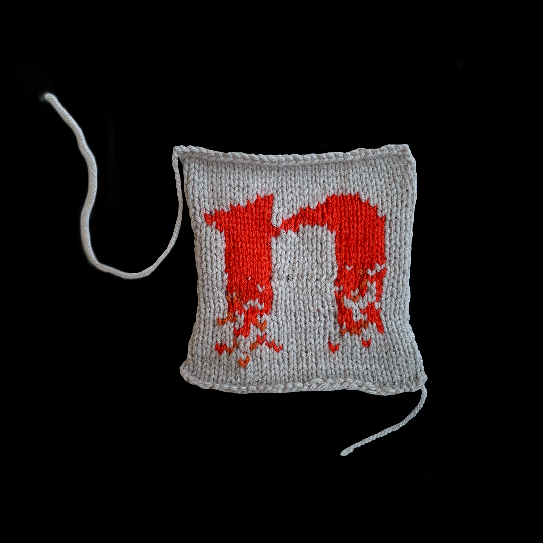 Image of a knitted letter